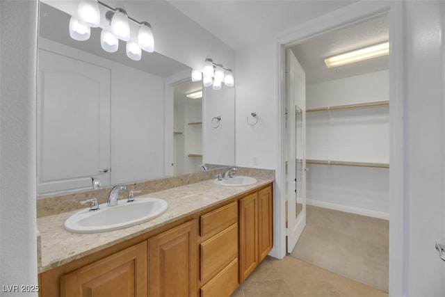 bathroom with tile patterned floors and vanity