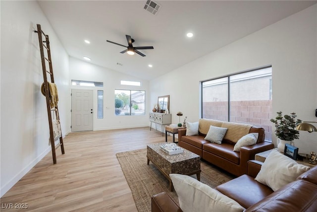 living room featuring ceiling fan, high vaulted ceiling, and light wood-type flooring