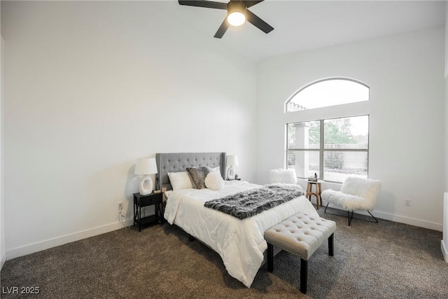 bedroom with ceiling fan and dark carpet