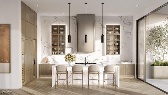 bar featuring light parquet flooring and sink