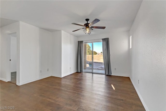 spare room with ceiling fan and dark hardwood / wood-style flooring