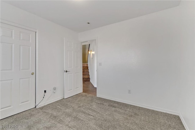 unfurnished bedroom featuring carpet flooring