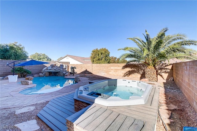 view of pool with a wooden deck and an outdoor hot tub