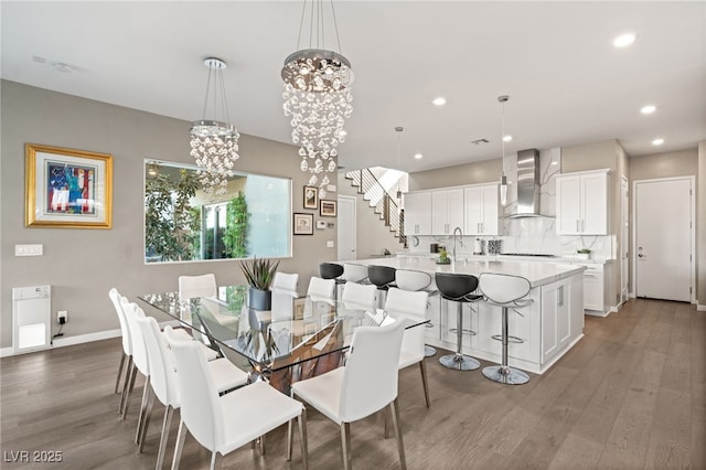 dining space with an inviting chandelier and dark hardwood / wood-style floors