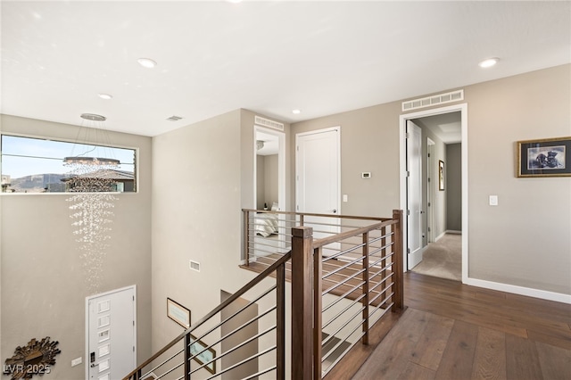 corridor featuring dark hardwood / wood-style flooring