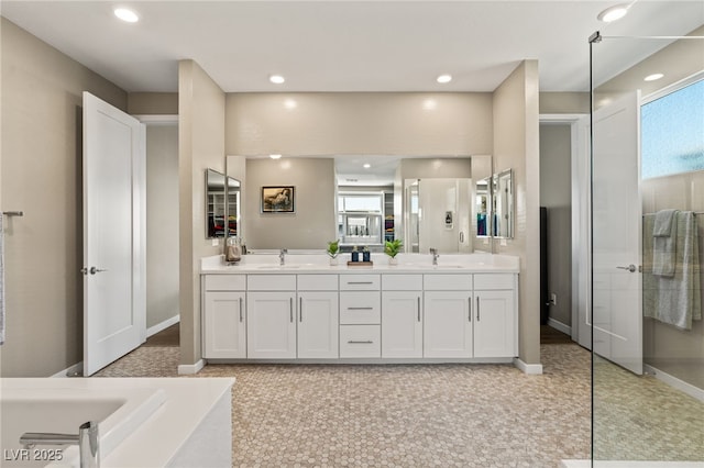 bathroom with vanity and a bathing tub