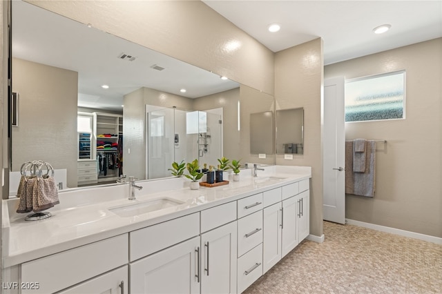 bathroom featuring vanity and an enclosed shower