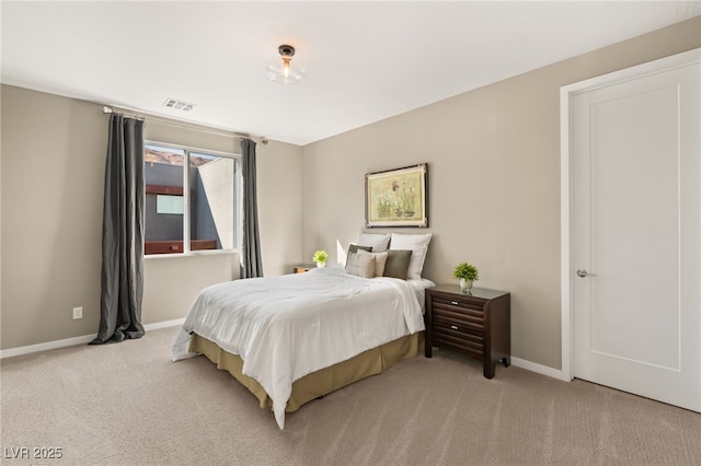 bedroom featuring light colored carpet