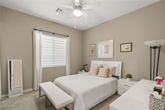 bedroom featuring light carpet and ceiling fan