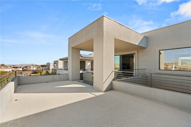 view of patio with a balcony