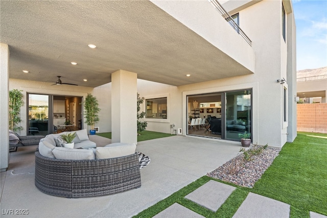 view of patio / terrace with ceiling fan and outdoor lounge area