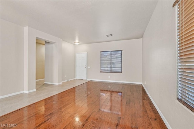 unfurnished room featuring hardwood / wood-style floors