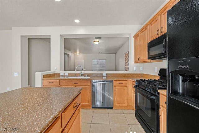 kitchen with sink, light tile patterned floors, black appliances, and light brown cabinets