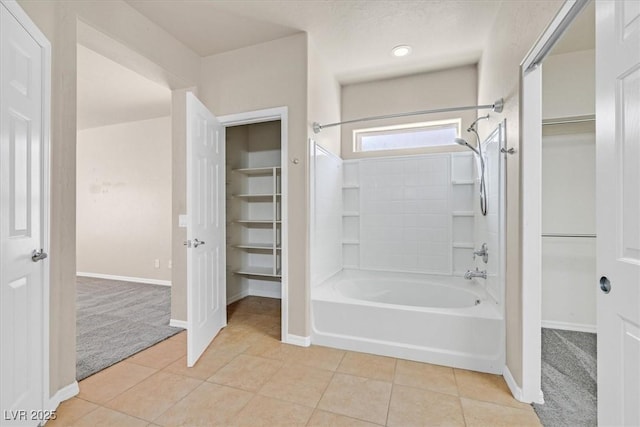 bathroom featuring tile patterned floors and bathtub / shower combination