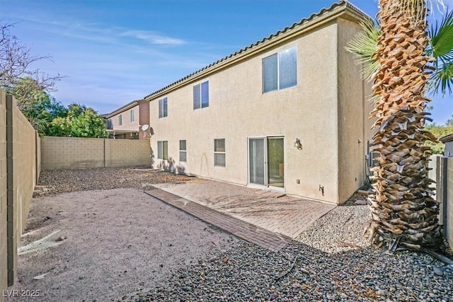 back of property featuring a patio