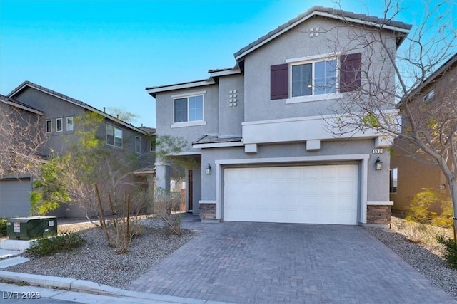 view of front property with a garage and central AC unit