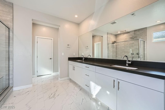 bathroom featuring walk in shower and vanity