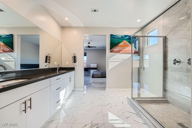 bathroom featuring vanity, a shower with door, and ceiling fan