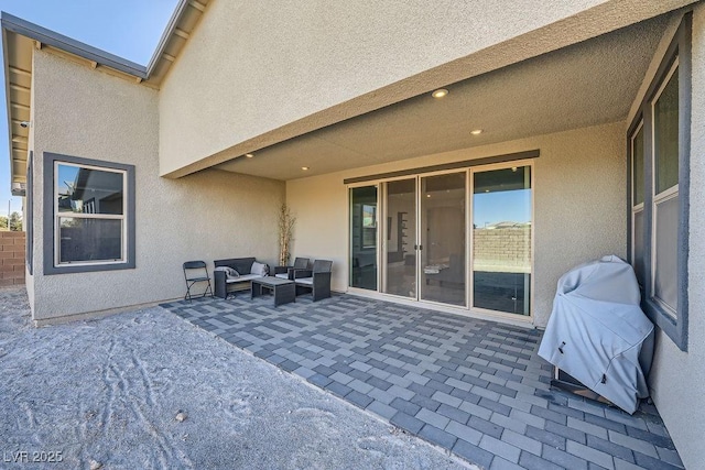 view of patio / terrace featuring an outdoor living space and a grill