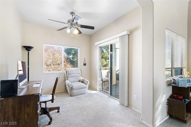 office featuring light carpet and ceiling fan