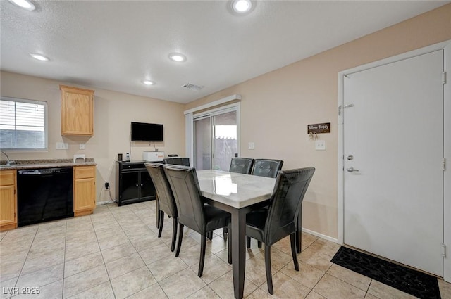 dining space featuring plenty of natural light and light tile patterned floors