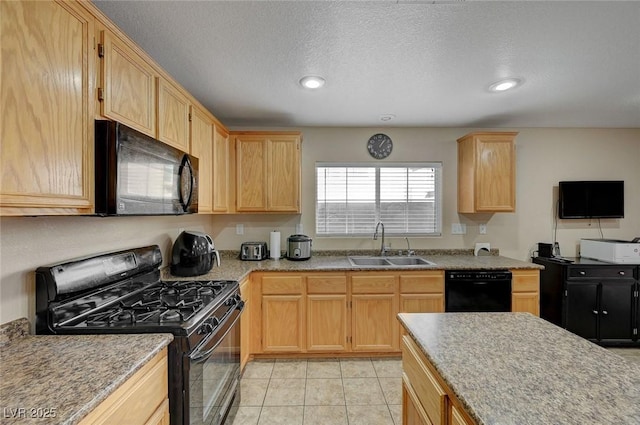 kitchen with sink, light tile patterned floors, black appliances, a textured ceiling, and light brown cabinetry