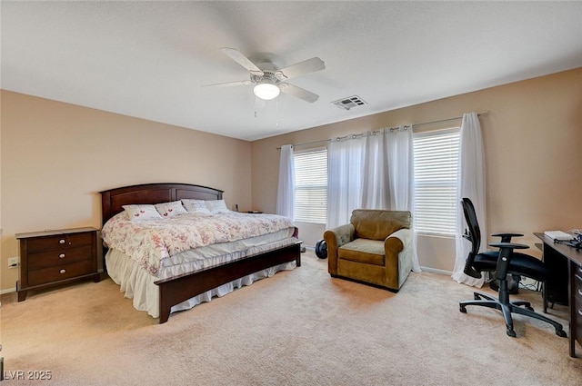 bedroom with light colored carpet and ceiling fan