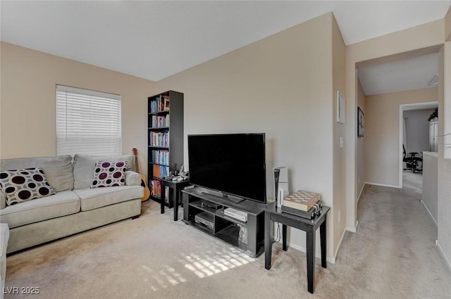 carpeted living room with lofted ceiling