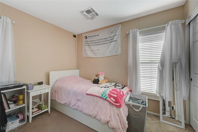 bedroom with light colored carpet