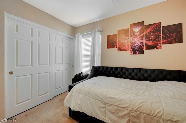 carpeted bedroom featuring a closet