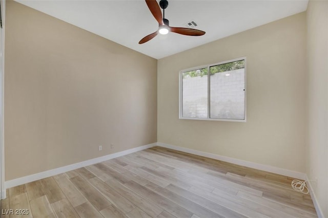 unfurnished room with ceiling fan and light hardwood / wood-style flooring