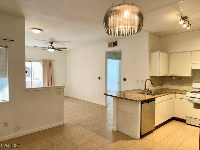 kitchen with white cabinetry, stainless steel dishwasher, sink, and gas range gas stove