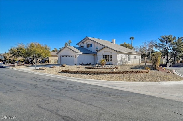 view of front of home with driveway and an attached garage