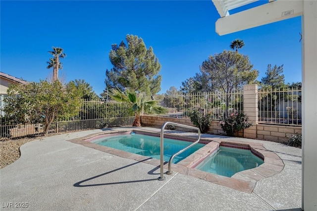 view of swimming pool featuring a fenced backyard, a fenced in pool, a patio, and an in ground hot tub