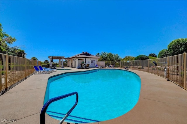 pool with fence and a patio