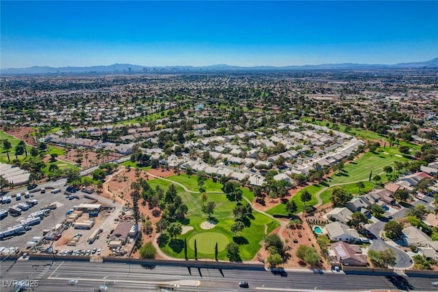 birds eye view of property with a residential view, a mountain view, and golf course view