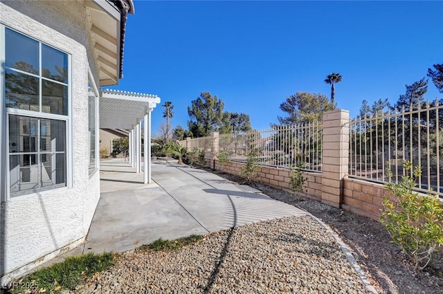 exterior space featuring a fenced backyard and a pergola