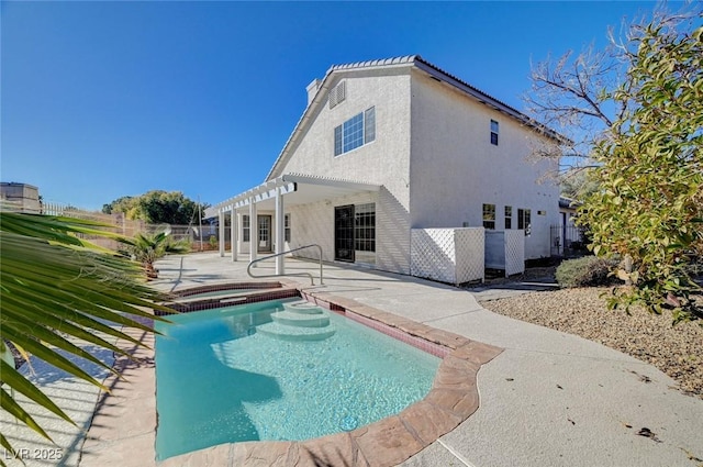 view of pool with an in ground hot tub, fence, a patio, and a pergola