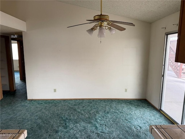 carpeted empty room with lofted ceiling, ceiling fan, and a textured ceiling