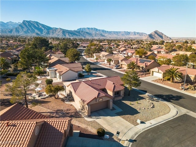 birds eye view of property with a mountain view