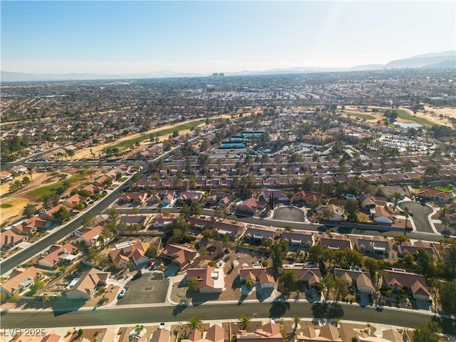 birds eye view of property with a mountain view