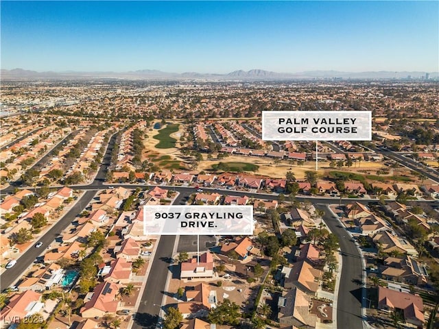 birds eye view of property with a mountain view