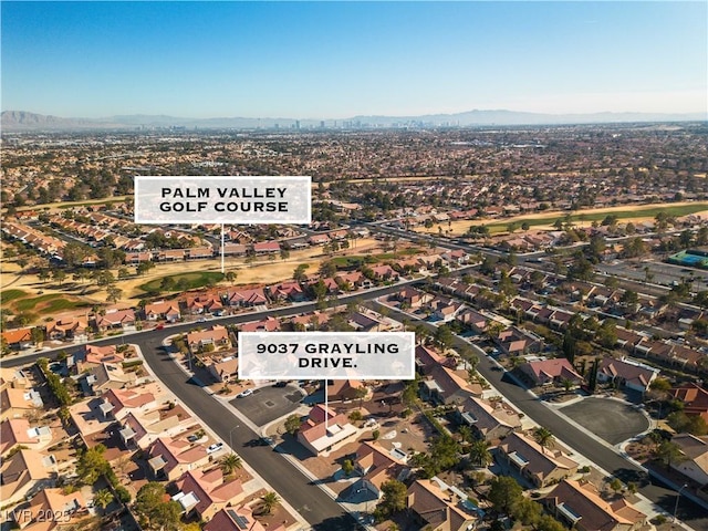 birds eye view of property with a mountain view