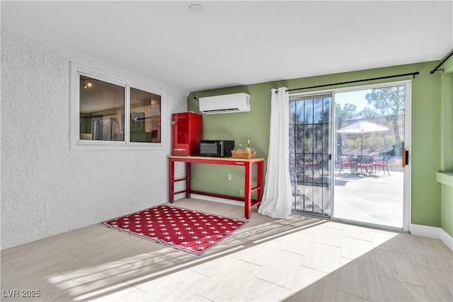 doorway featuring a wall unit AC