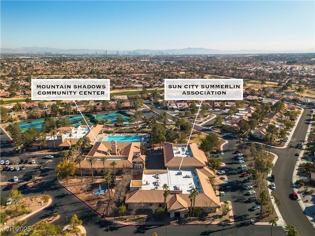 birds eye view of property featuring a mountain view