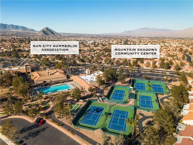 birds eye view of property featuring a mountain view