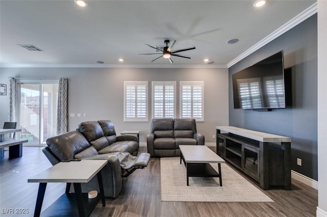 living room featuring dark hardwood / wood-style flooring, ornamental molding, and ceiling fan