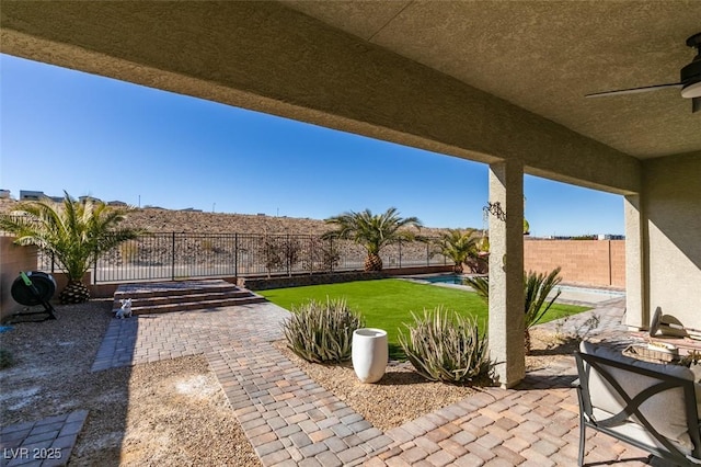 view of patio / terrace featuring ceiling fan