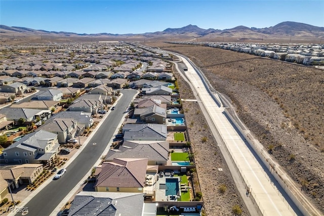 drone / aerial view featuring a mountain view