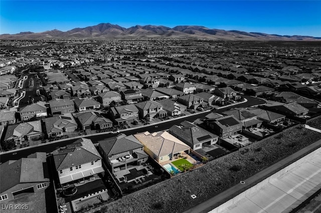 birds eye view of property featuring a mountain view